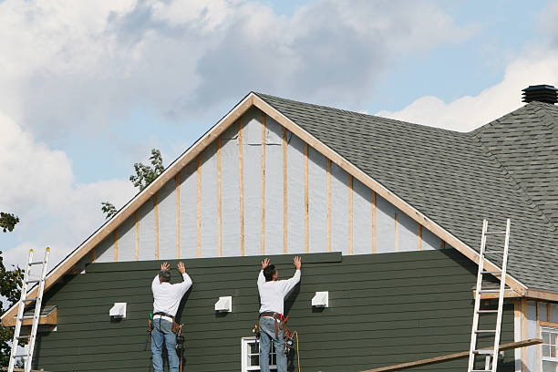 Professional Siding Installation technician working in East Freedom, PA